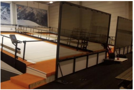 Ski simulator lanes and safety railing